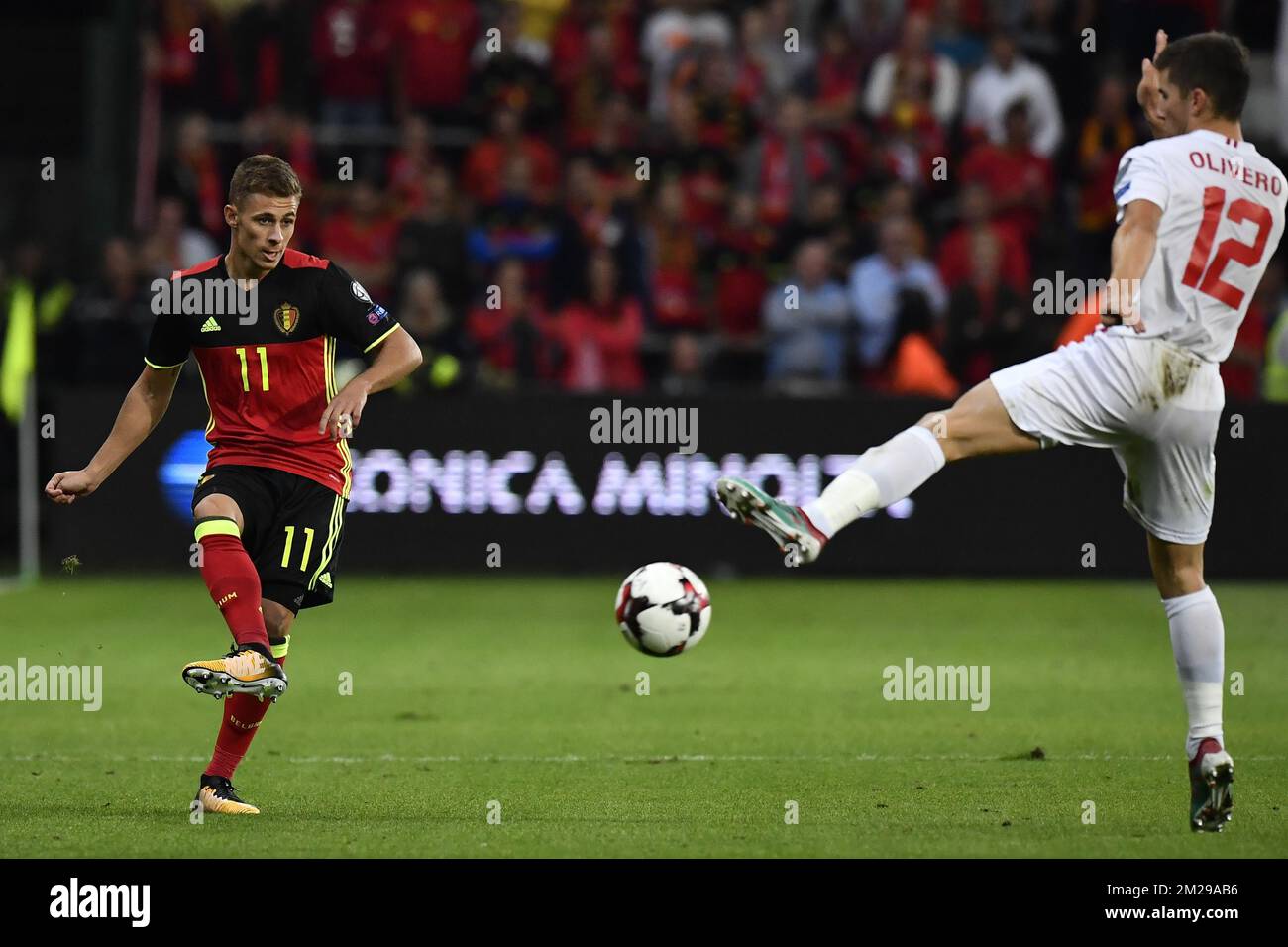 Belgium's Thorgan Hazard and Gibraltar's Jayce Mascarenhas-Olivero pictured in action during a soccer between Belgian national soccer team Red Devils and Gibraltar, a World Cup 2018 qualification game in Group H, Thursday 31 August 2017 in Liege, Belgium. BELGA PHOTO DIRK WAEM Stock Photo