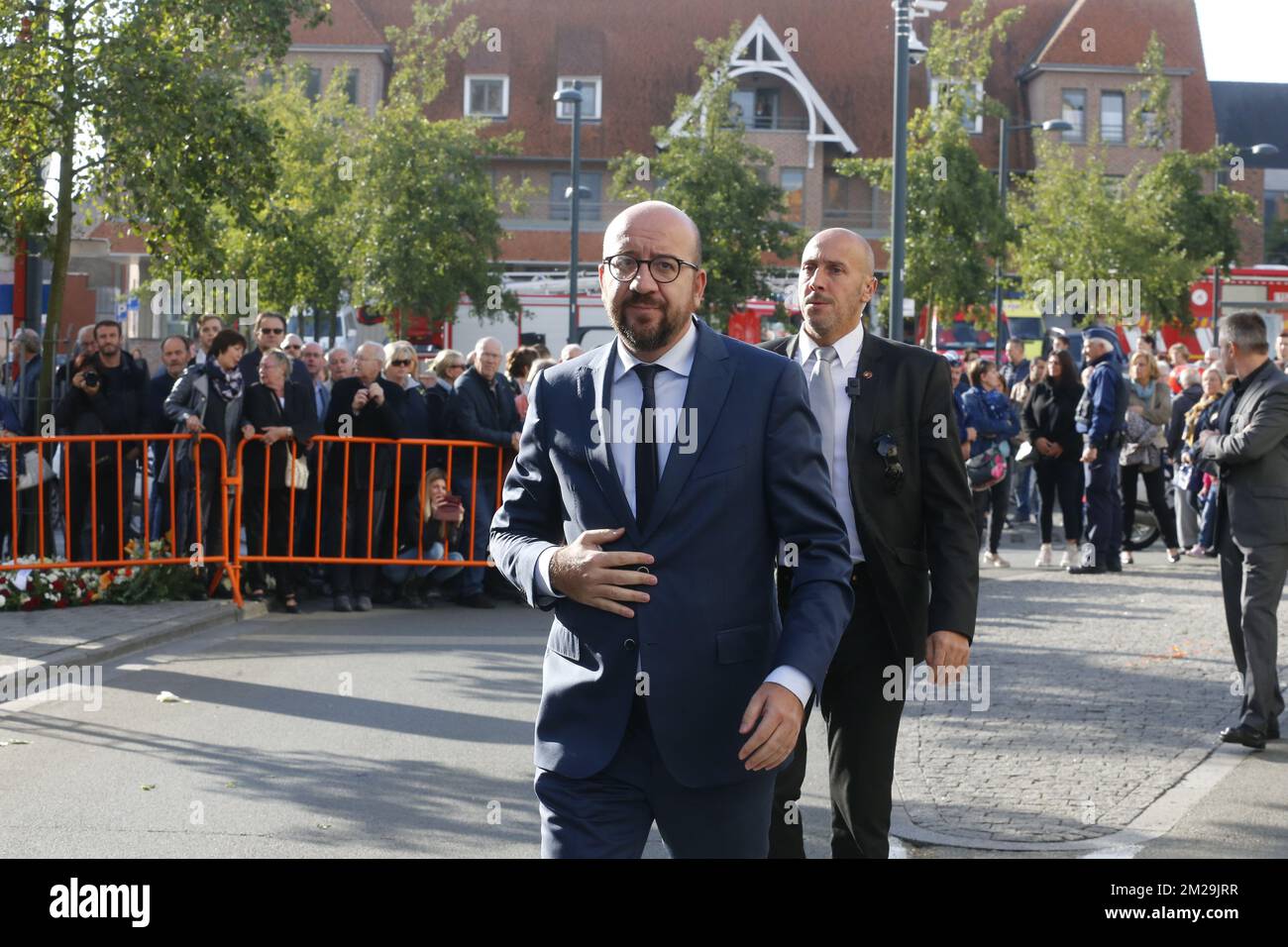 Belgian Prime Minister Charles Michel arriving at the funeral of mayor Alfred Gadenne at 'Saint-Amand' church in Luingne, . In the evening of Tuesday September 11th the 71 year old Gadenne went to close the gates of the cemetery across the street from his house, where his throat was slit. The attacker turned himself in to police after the facts. BELGA PHOTO NICOLAS MAETERLINCK  Stock Photo