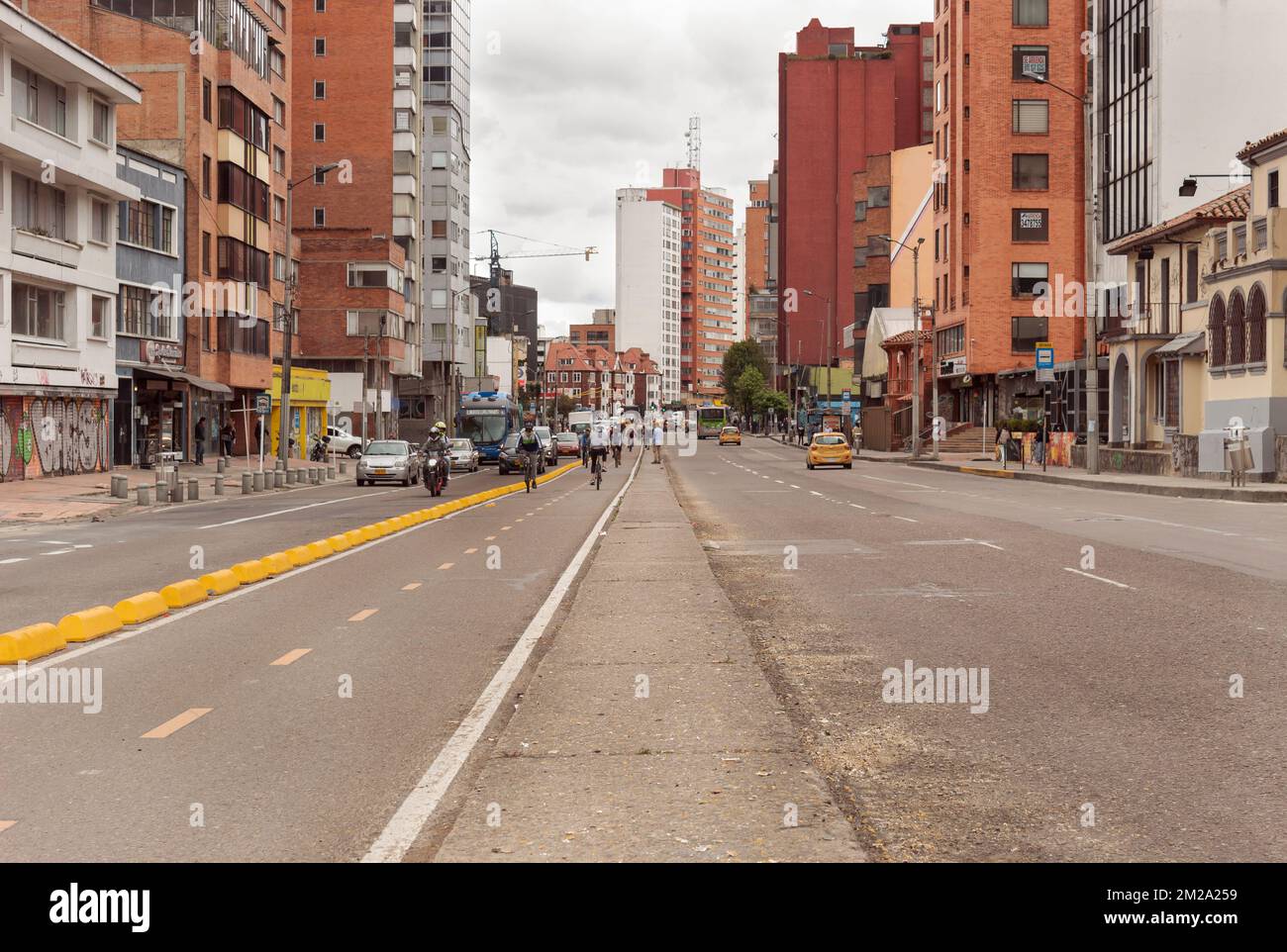 BOGOTA, COLOMBIA A wide open shot of 7th avenue at Chapinero neighborhood. One of the most bogota avenue at normal day midday with cicloruta bikepath Stock Photo
