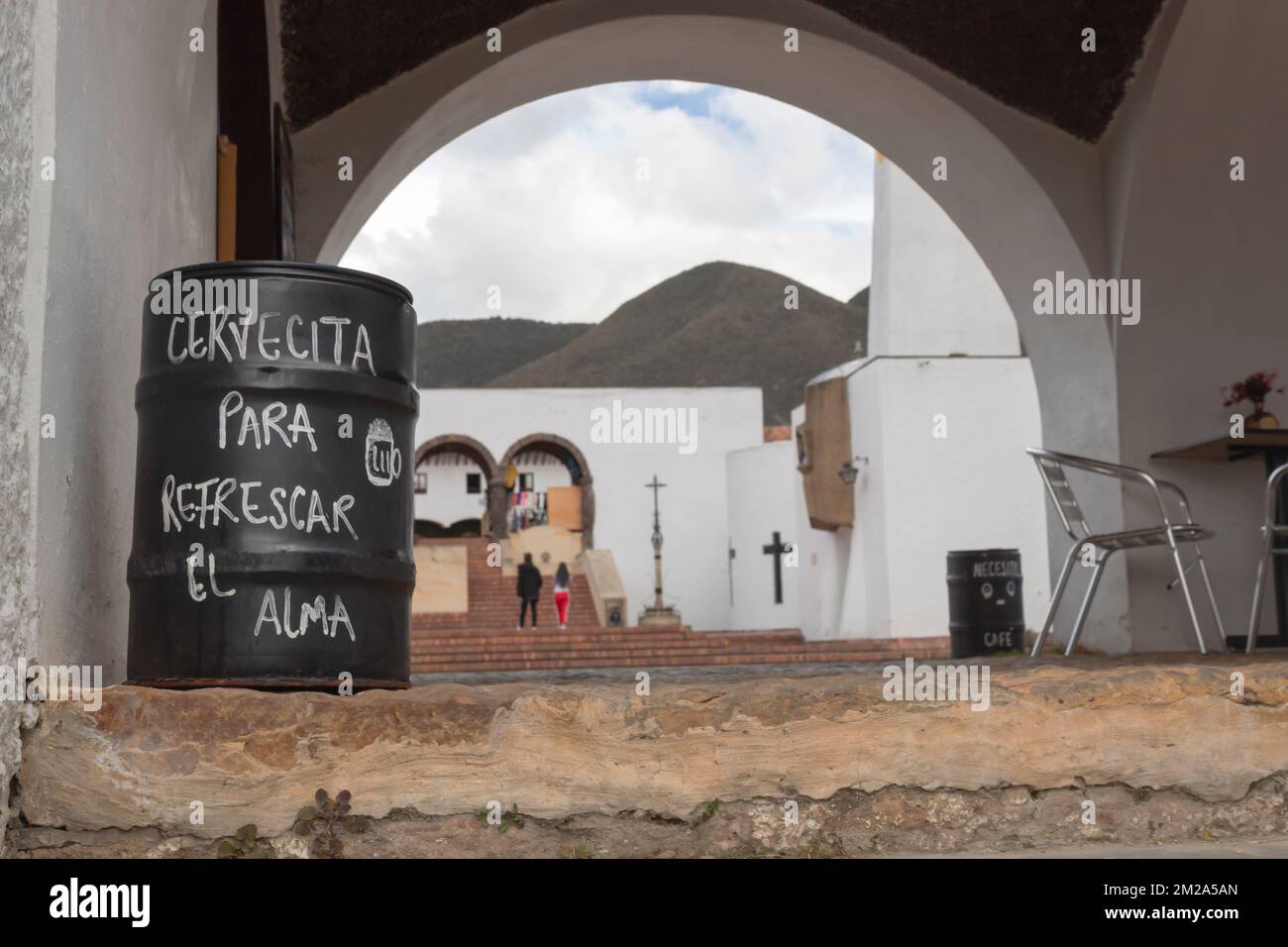GUATAVITA, COLOMBIA - A leyend in spanish language about happines and beer writing in a black barrel of a guatavita town restaurant Stock Photo