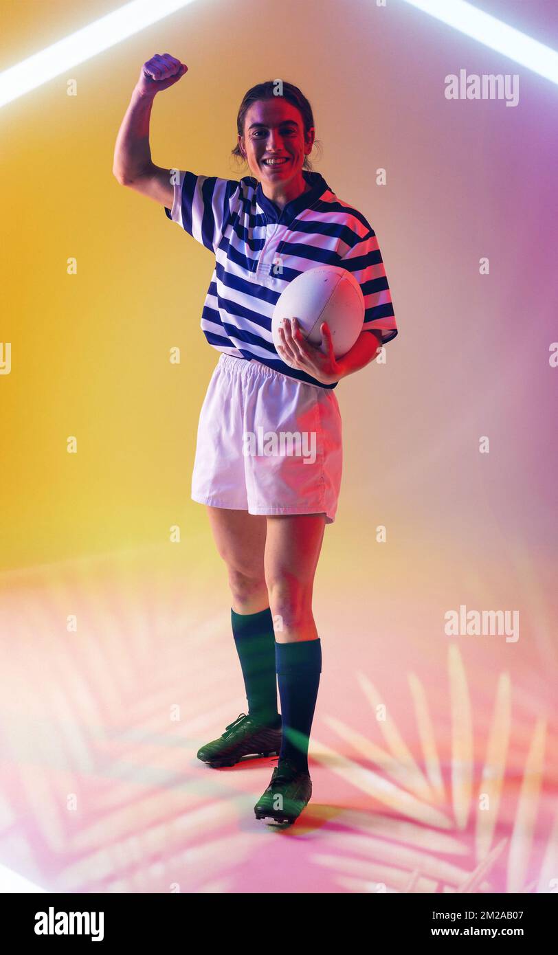 Touch Rugby Hand Signs Happy caucasian female rugby player holding ball and raising hand over ...