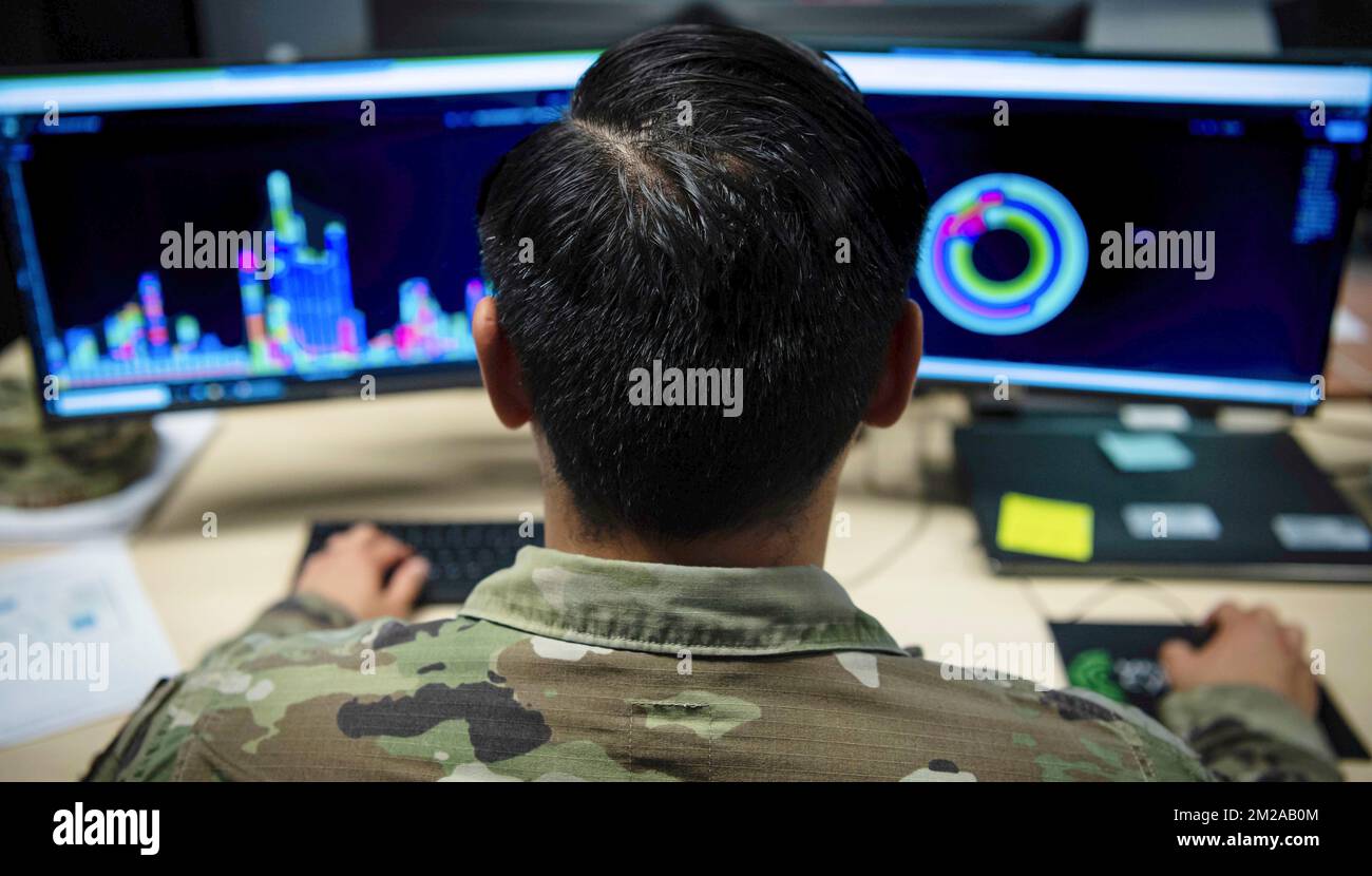 US Air Force Staff Sergeant performing network analysis Stock Photo