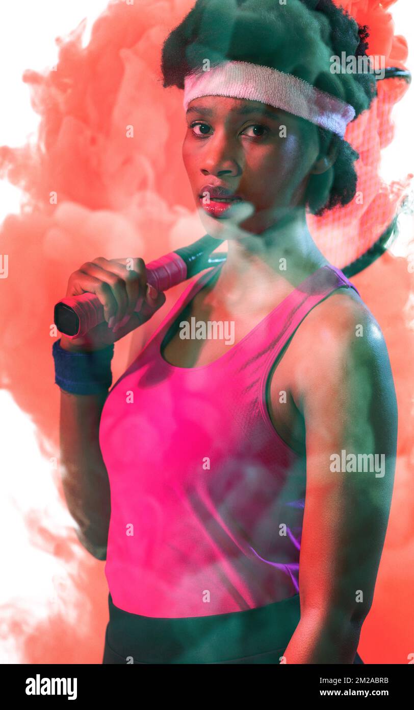 Portrait Of African American Female Tennis Player With Racket Over Red portrait-of-african-american-female-tennis-player-with-racket-over-red