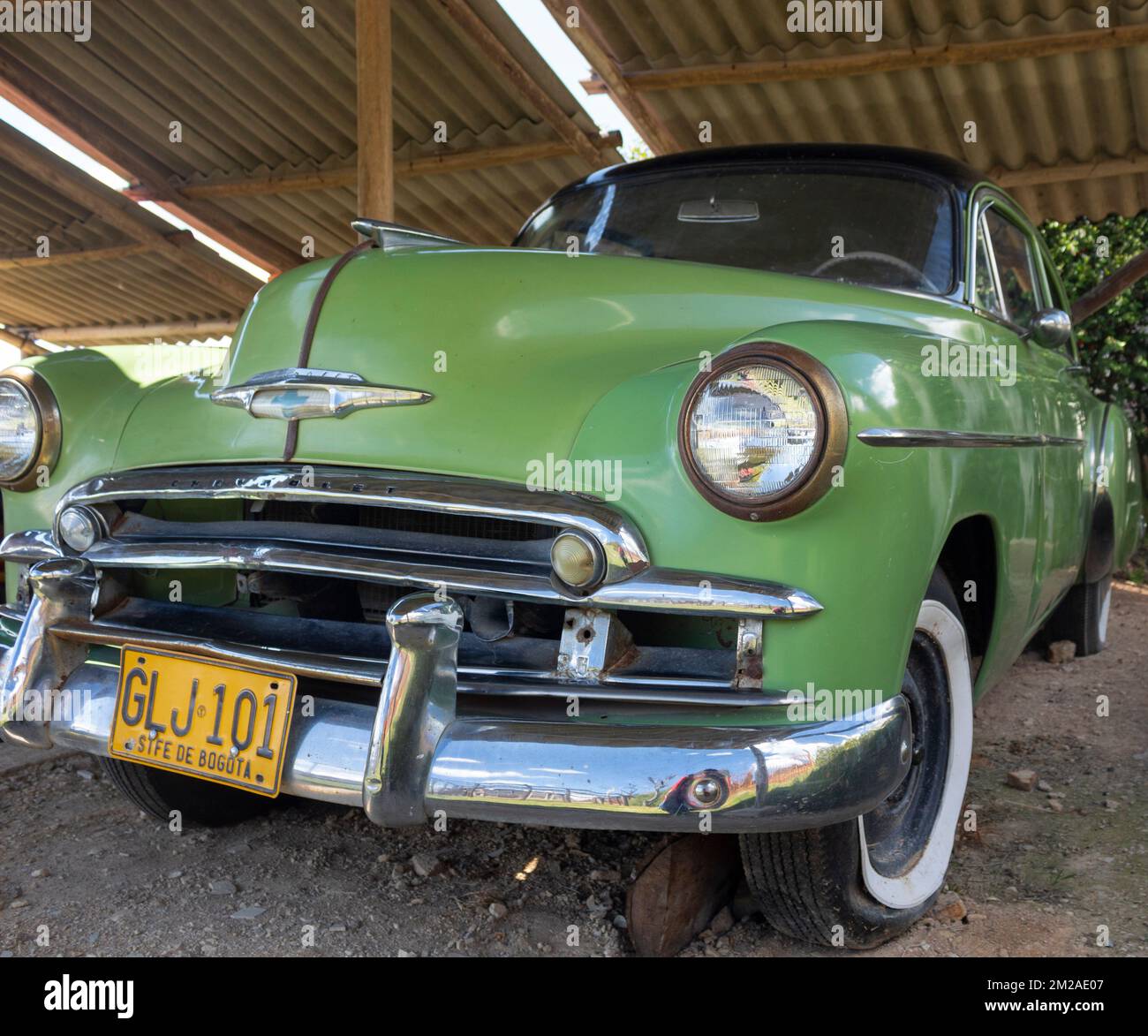 An antique chevrolet green car in boyaca colombia town Stock Photo - Alamy