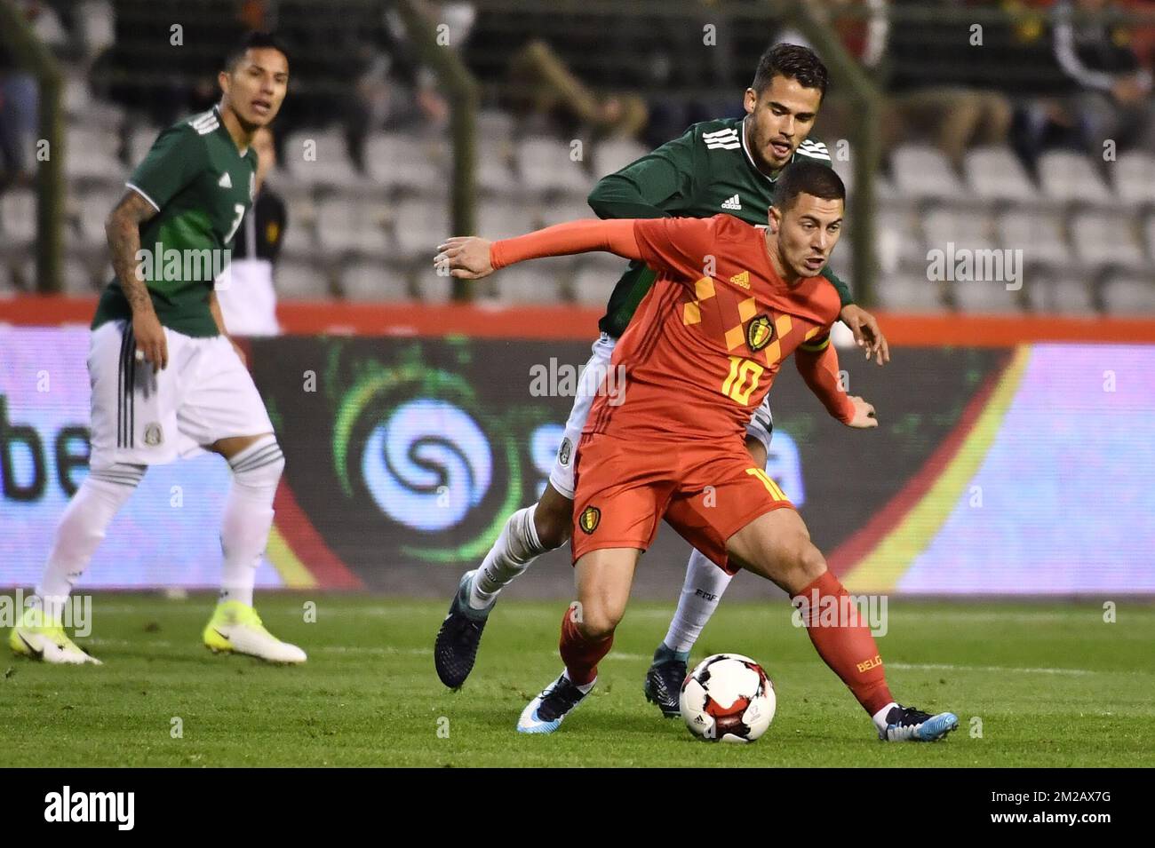 Belgium's Eden Hazard and Mexico's Diego Reyes fight for the ball during a friendly soccer game between Belgian national team Red Devils and Mexico, Friday 10 November 2017, in Brugge. BELGA PHOTO DIRK WAEM  Stock Photo