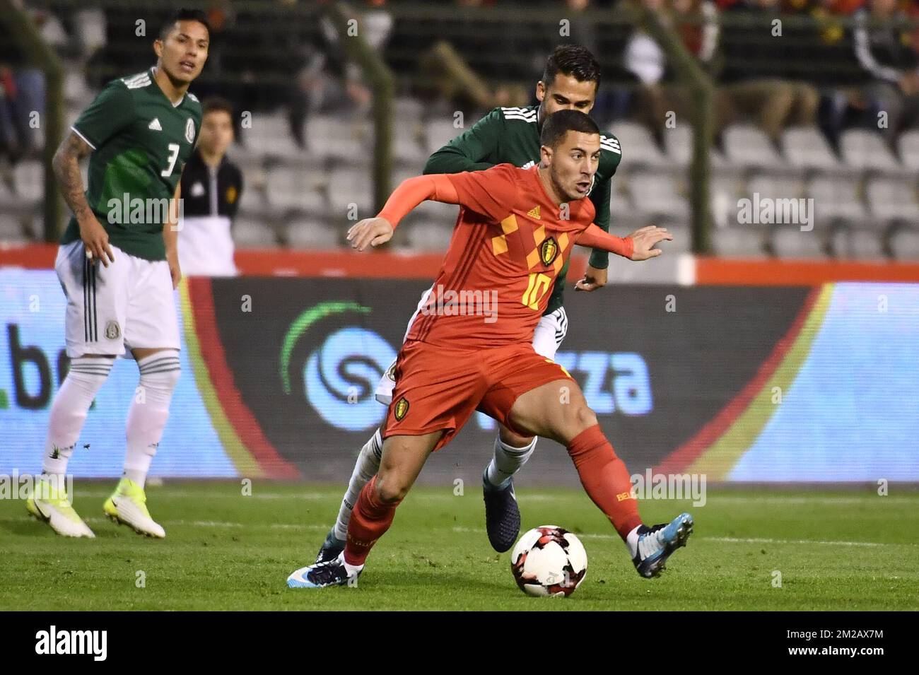 Belgium's Eden Hazard and Mexico's Diego Reyes fight for the ball during a friendly soccer game between Belgian national team Red Devils and Mexico, Friday 10 November 2017, in Brugge. BELGA PHOTO DIRK WAEM  Stock Photo