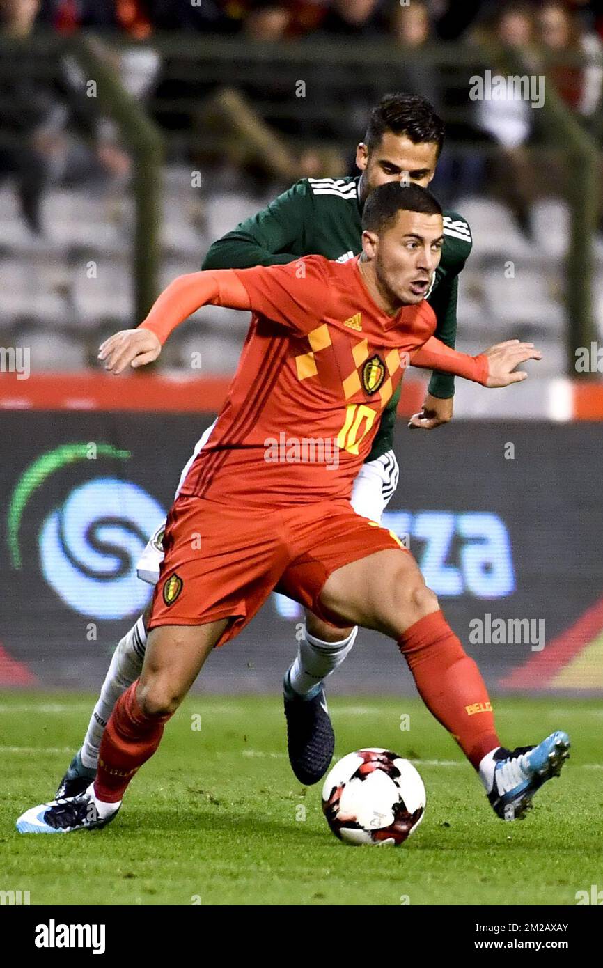 Belgium's Eden Hazard and Mexico's Diego Reyes pictured in action during a friendly soccer game between Belgian national team Red Devils and Mexico, Friday 10 November 2017, in Brugge. BELGA PHOTO DIRK WAEM Stock Photo