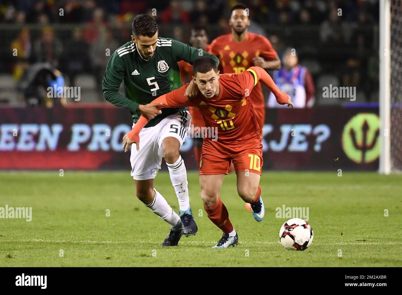 Mexico's Diego Reyes and Belgium's Eden Hazard fight for the ball during a friendly soccer game between Belgian national team Red Devils and Mexico, Friday 10 November 2017, in Brugge. BELGA PHOTO DIRK WAEM Stock Photo