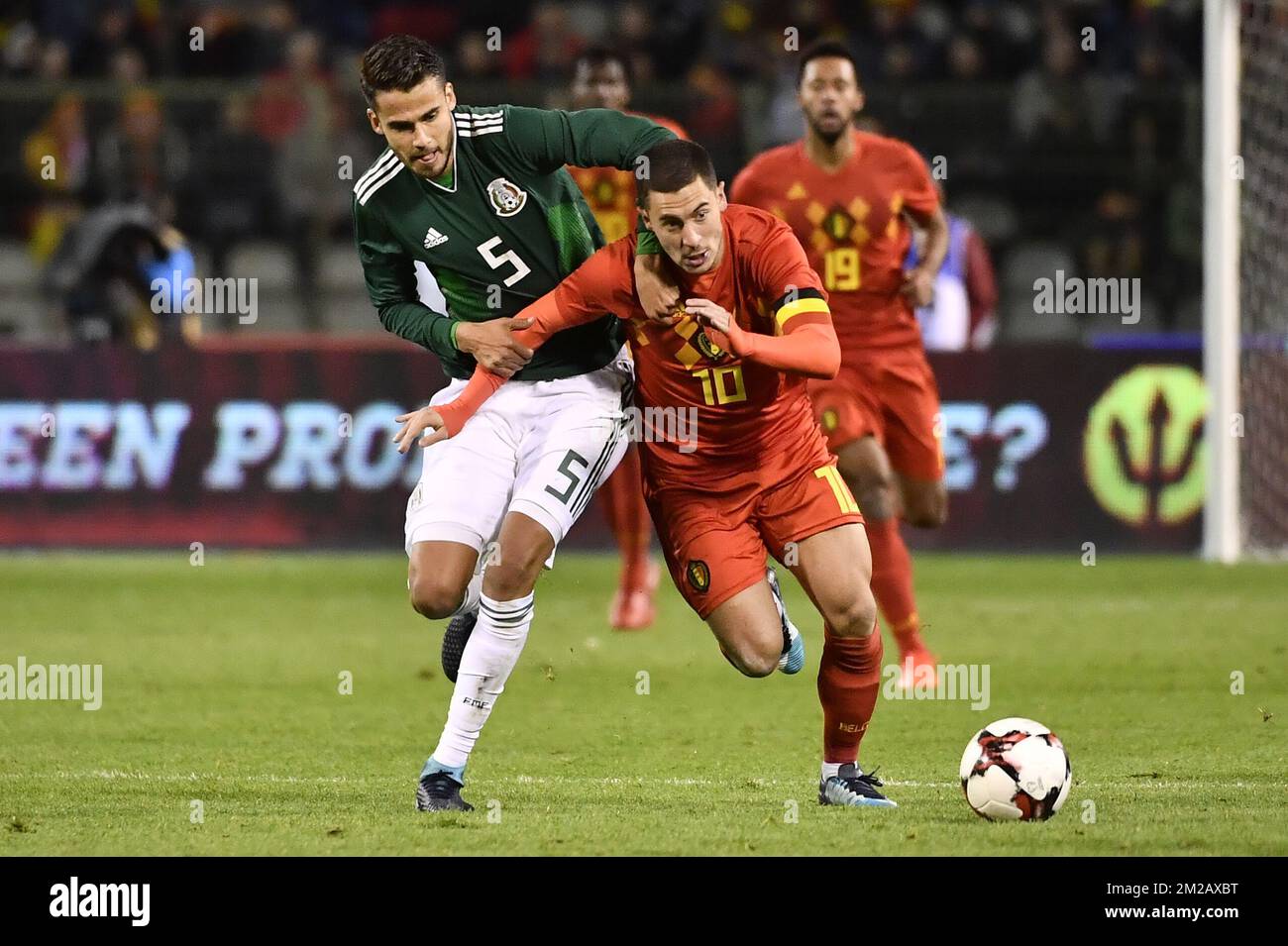 Mexico's Diego Reyes and Belgium's Eden Hazard fight for the ball during a friendly soccer game between Belgian national team Red Devils and Mexico, Friday 10 November 2017, in Brugge. BELGA PHOTO DIRK WAEM Stock Photo