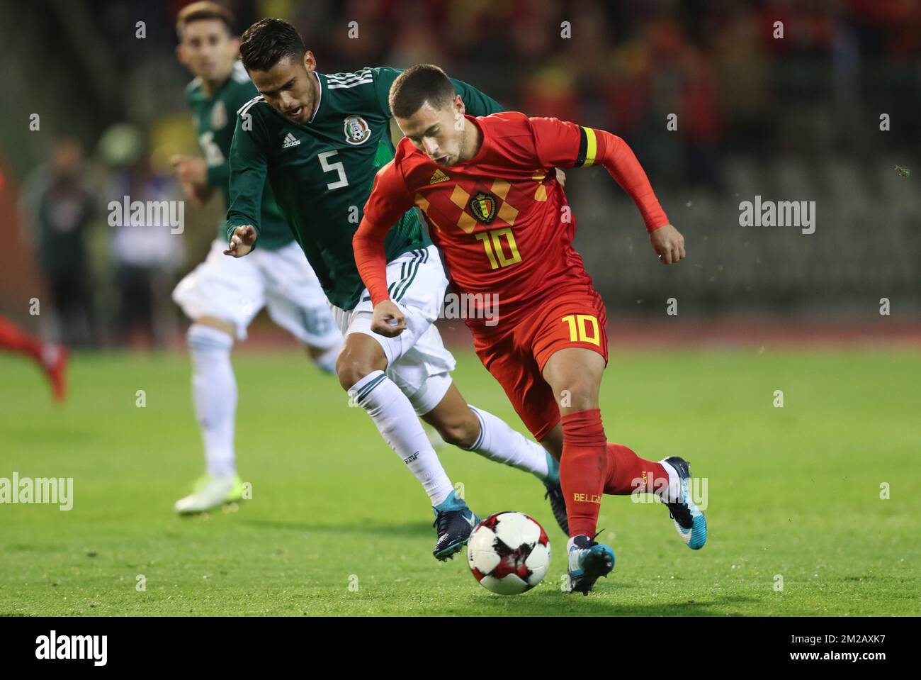 Mexico's Diego Reyes and Belgium's Eden Hazard fight for the ball during a friendly soccer game between Belgian national team Red Devils and Mexico, Friday 10 November 2017, in Brugge. BELGA PHOTO VIRGINIE LEFOUR Stock Photo