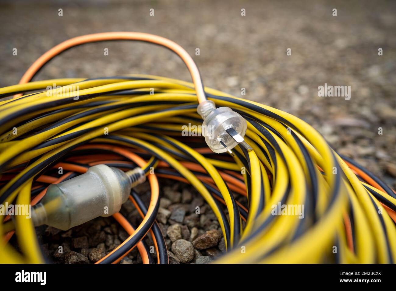 power lead on a building site, electrician with a power cable outside