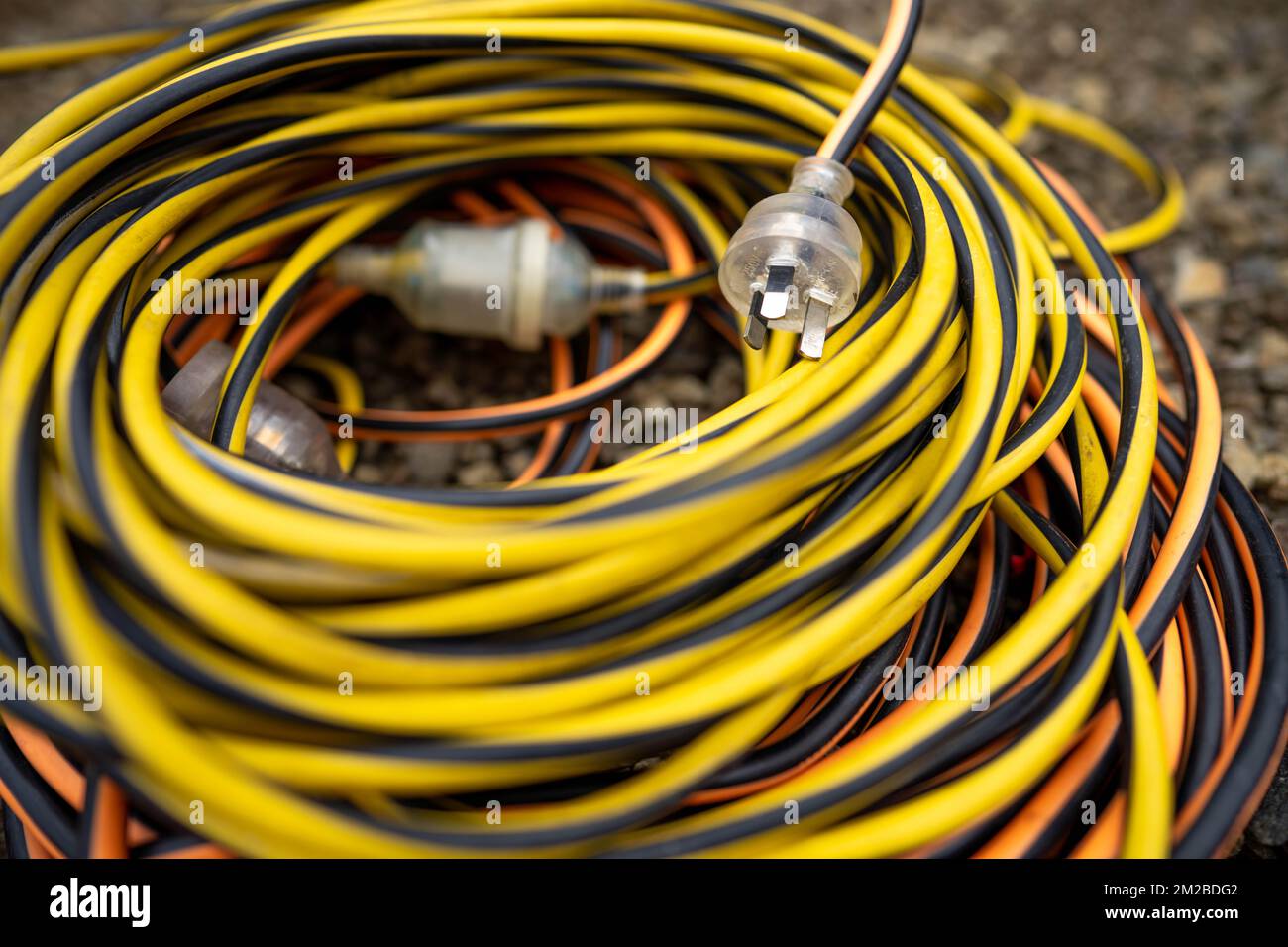 power lead on a building site, electrician with a power cable outside Stock Photo