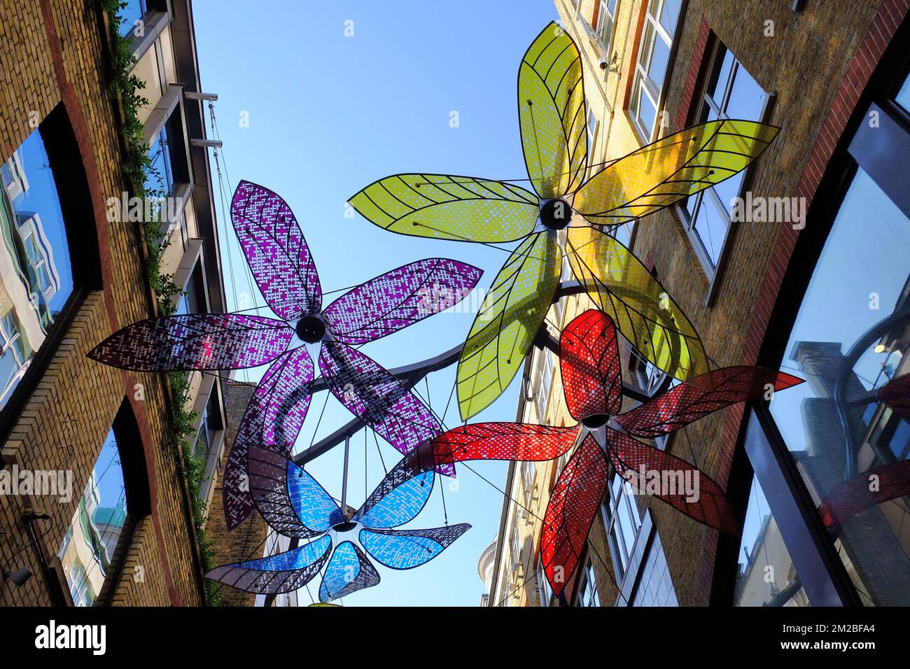 Large colourful flower artwork across Slingsby Place, Covent Garden, London, England Stock Photo