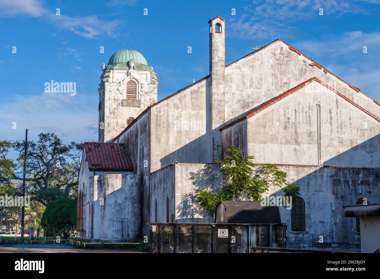 NEW ORLEANS, LA, USA - DECEMBER 11, 2022: Back of Our Lady of Lourdes Catholic Church with geometric patterns formed by shadows in Uptown New Orleans Stock Photo
