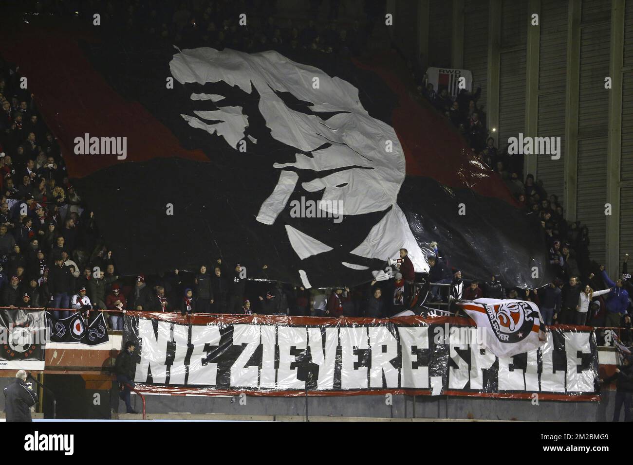 RWD Molenbeek supporters with tifo of Raymond Goethals pictured during a soccer game between RWDM Molenbeek and FC Liege, in the second amateur class, Saturday 16 December 2017 in Brussels. BELGA PHOTO NICOLAS MAETERLINCK Stock Photo