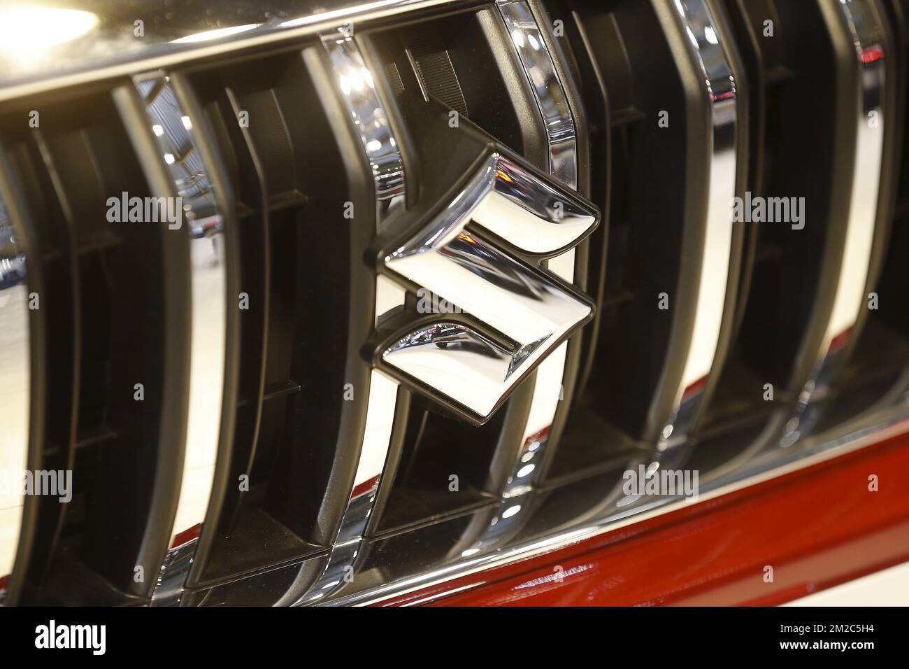 Suzuki logo pictured during the 96th edition of the Brussels Motor Show, at Brussels Expo, on Sunday 14 January 2018, in Brussels. BELGA PHOTO NICOLAS MAETERLINCK Stock Photo