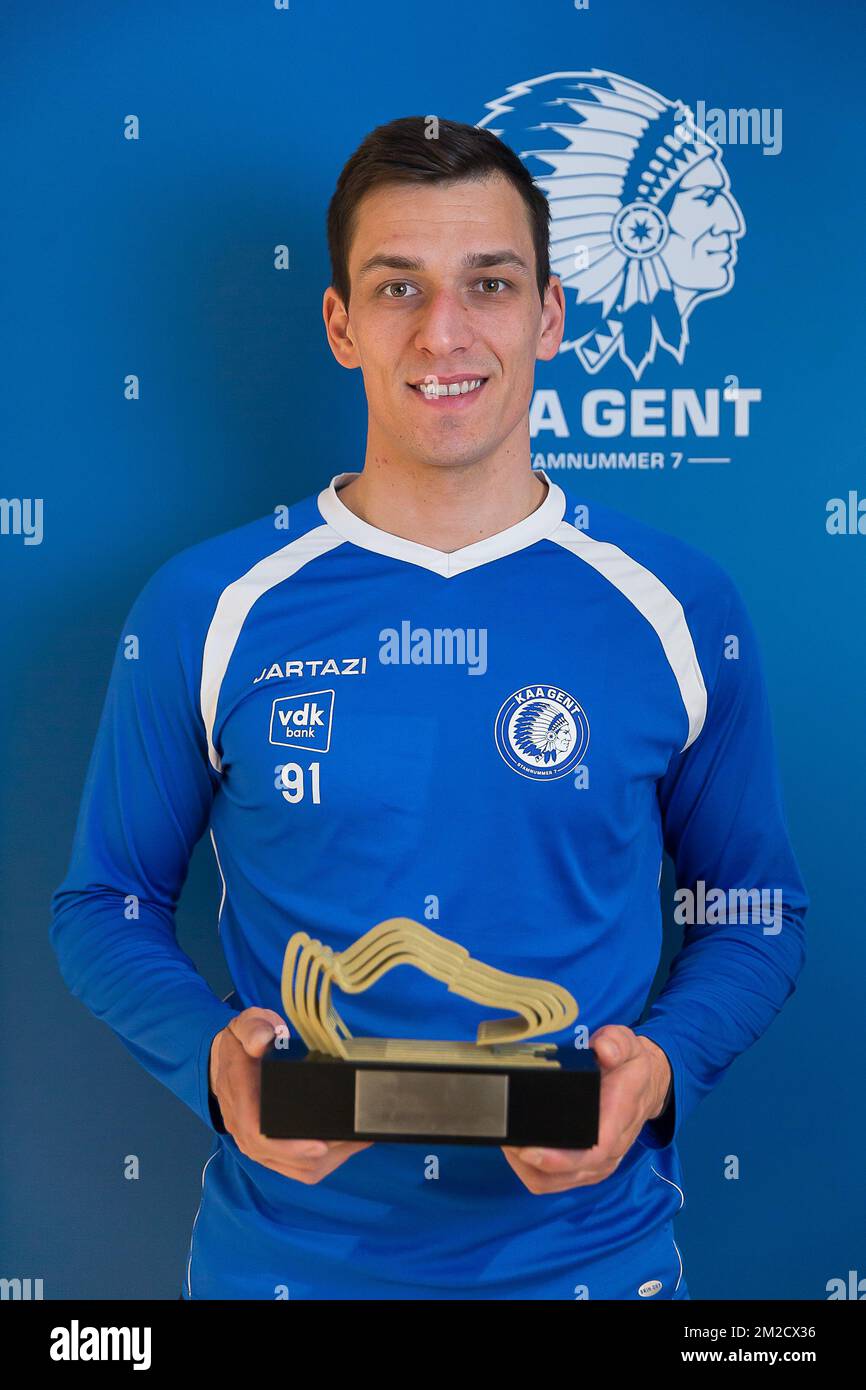 Gent's goalkeeper Lovre Kalinic poses with the Golden Shoe trophy for