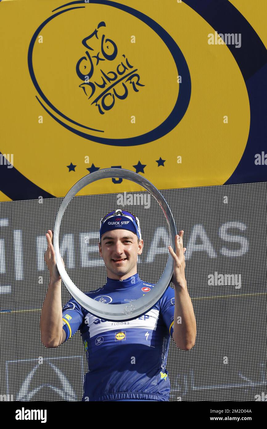 Italian Elia Viviani of Quick-Step Floors celebrates on the podium as winner of the General Classification after the fifth and last stage of the Dubai Tour 2018 cycling race, 129 km from the Skydive and the city WAlk in Dubai, United Arab Emirates, Saturday 10 February 2018. The Dubai Tour 2018 is taking place from 6 to 10 February. BELGA PHOTO YUZURU SUNADA Stock Photo