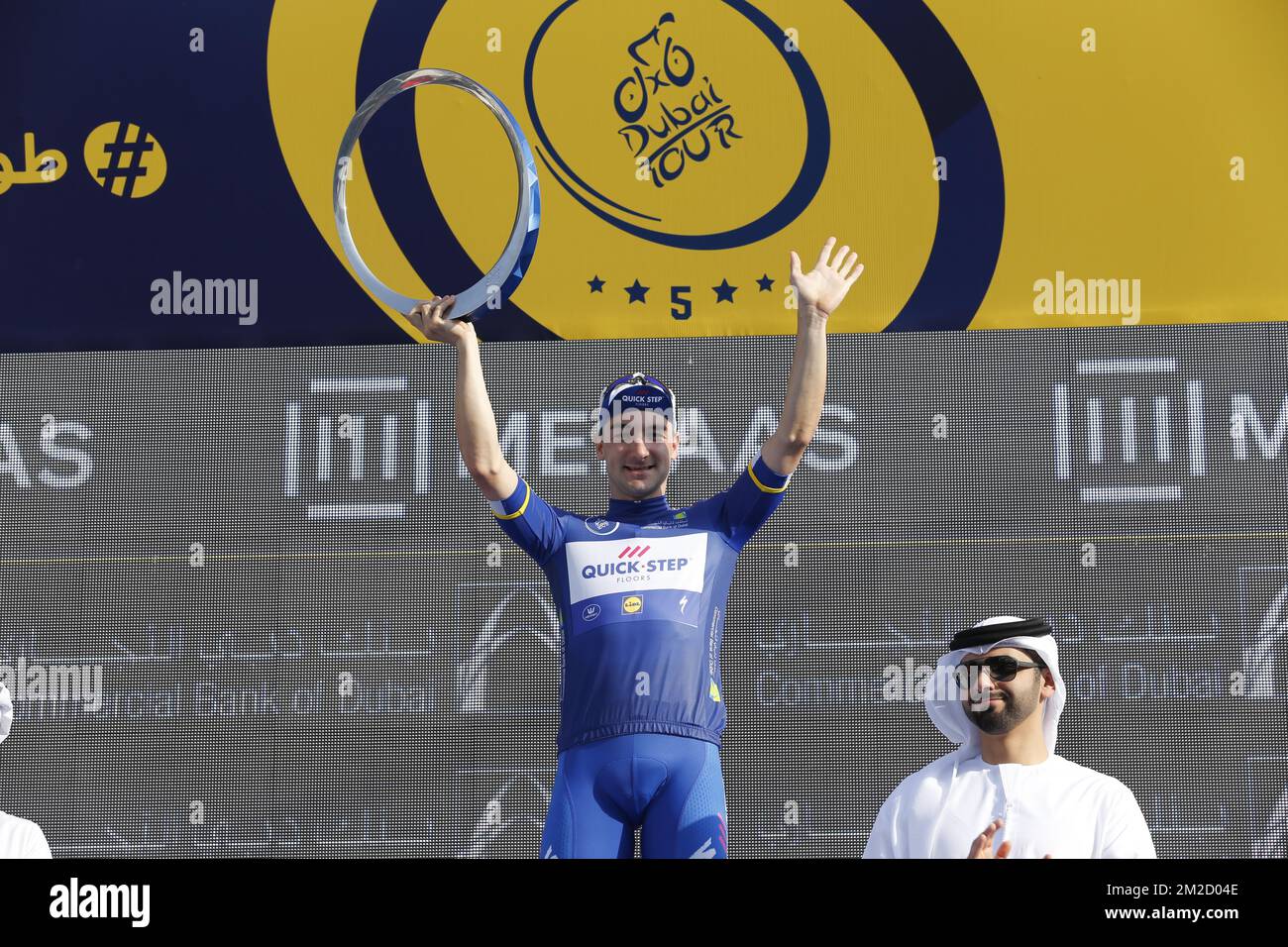 Italian Elia Viviani of Quick-Step Floors celebrates on the podium as winner of the General Classification after the fifth and last stage of the Dubai Tour 2018 cycling race, 129 km from the Skydive and the city WAlk in Dubai, United Arab Emirates, Saturday 10 February 2018. The Dubai Tour 2018 is taking place from 6 to 10 February. BELGA PHOTO YUZURU SUNADA Stock Photo