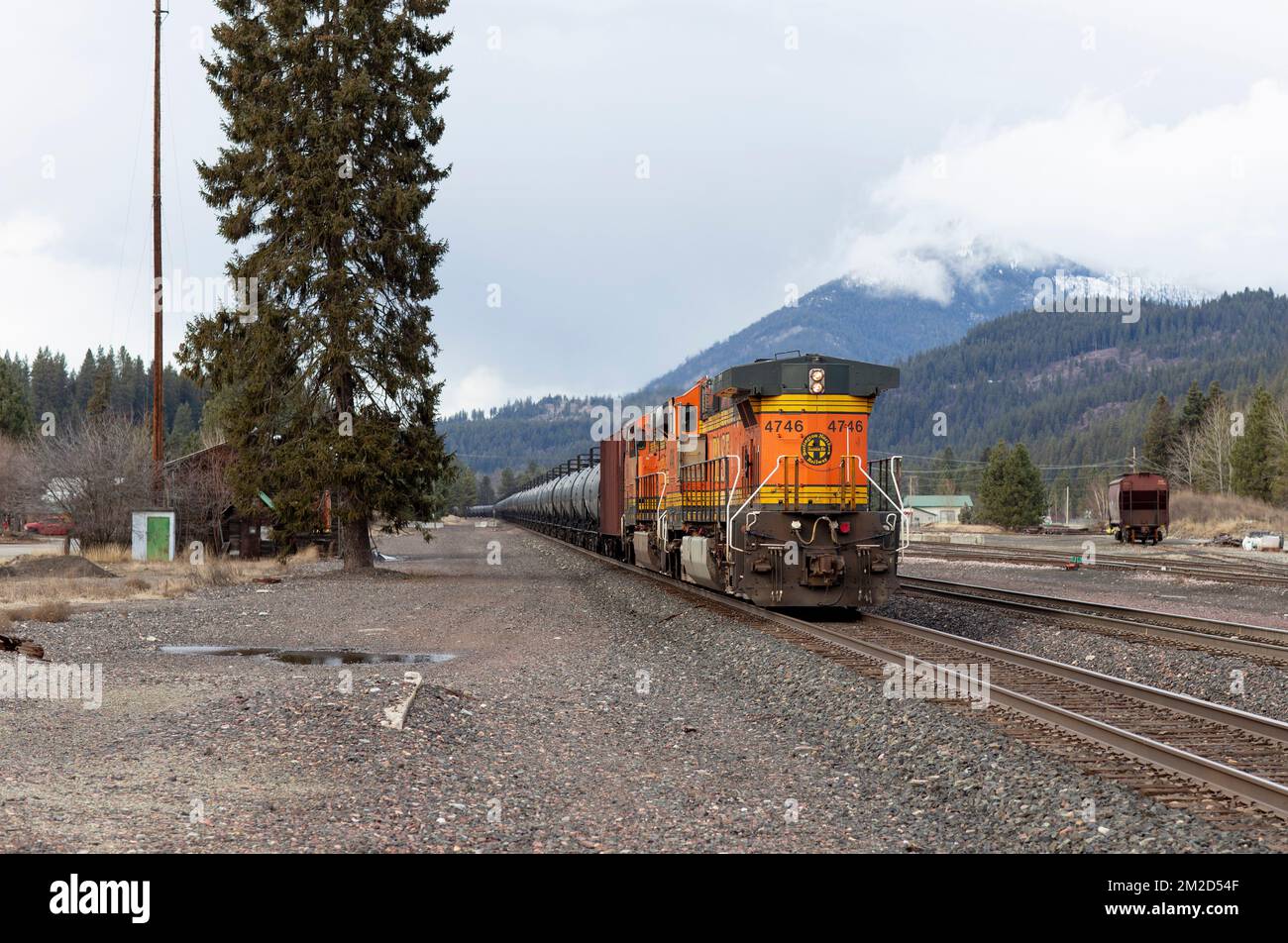 Troy, Montana, USA. February 23, 2021. The tailing GE C449W diesel push of a BNSF