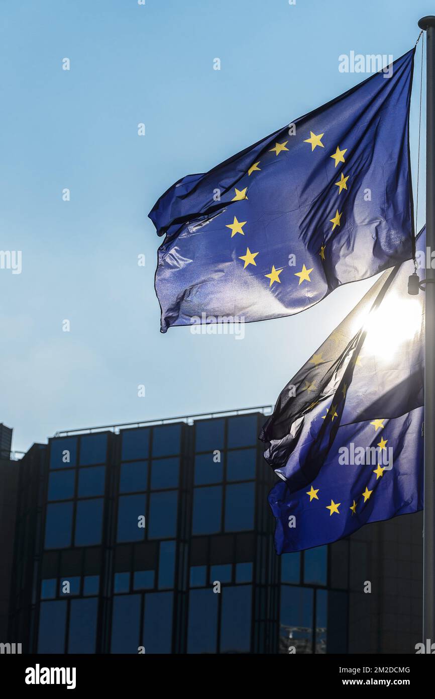 Several official European Flags with the blue and the yellow stars are hoisted along the Berlaymont building | Plusieurs drapeaux officiels europeens sont hisses le long du Berlaymont 27/02/2018  Stock Photo