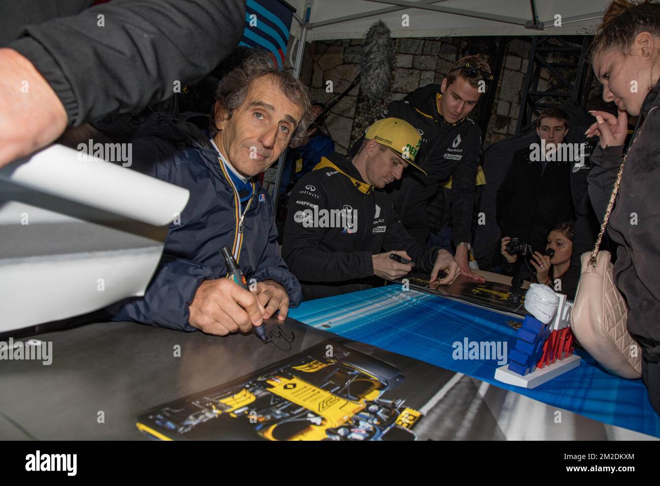 Alain Prost, Quadruple F1 World Champion and Nico Hulkenberg, Official driver of the Renault Sport Formula One Team team in signing sessions in Nice. | Alain Prost, Quadruple champion du monde de F1 et Nico Hulkenberg, Pilote officiel de l'écurie de la Renault Sport Formula One Team en séance de dédicaces à Nice . 11/03/2018 Stock Photo