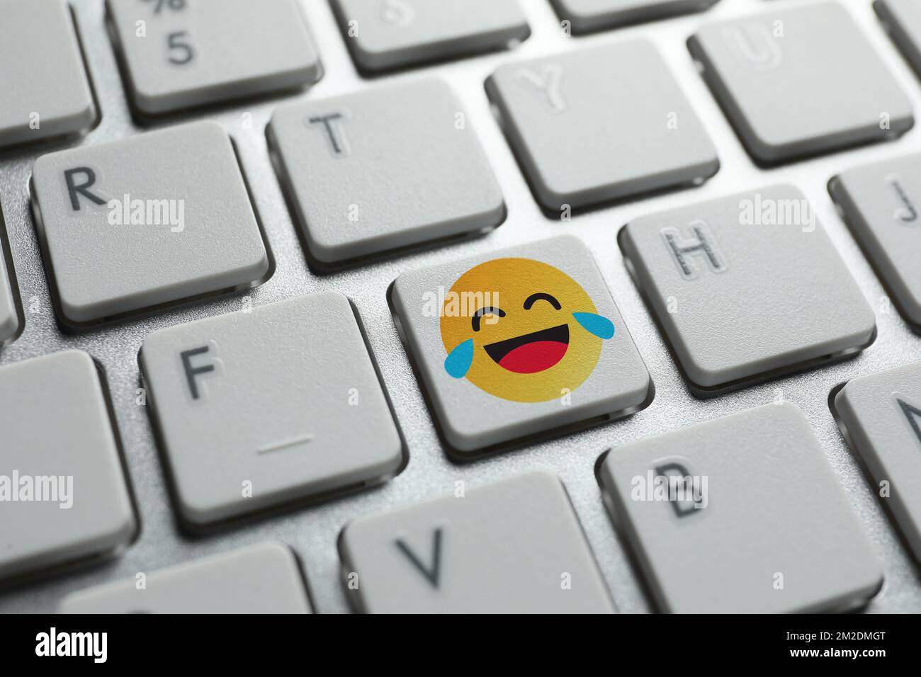 Laughing emoticon on PC keyboard, closeup Stock Photo Alamy