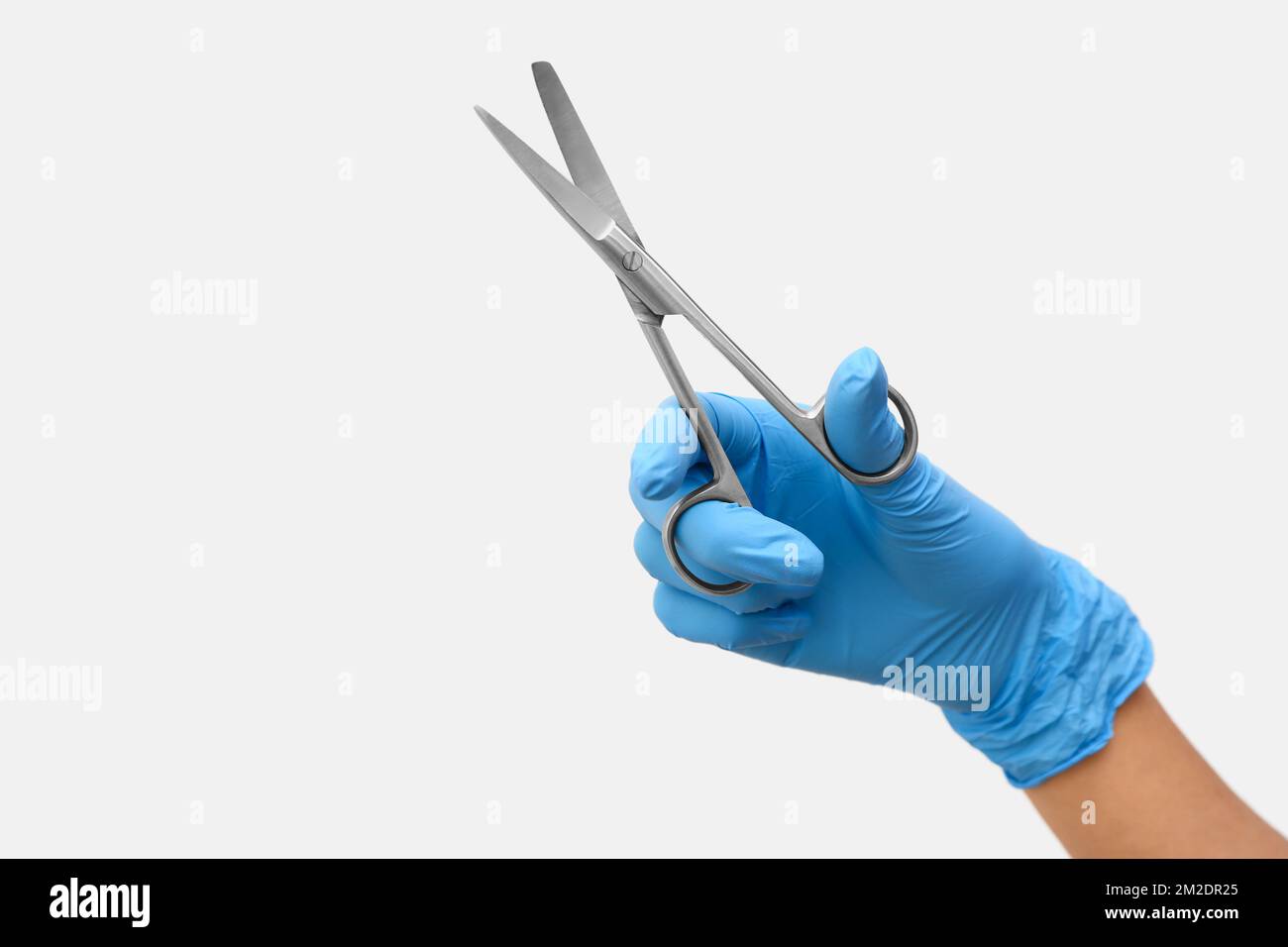 Female doctor with scissors on white background Stock Photo Alamy