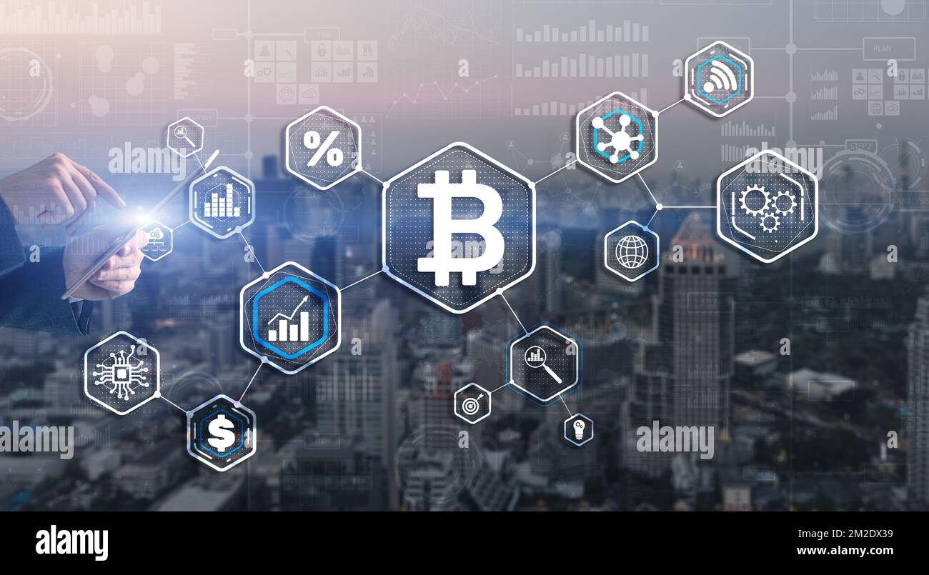 Man clicks on a virtual screen bitcoin icon Stock Photo