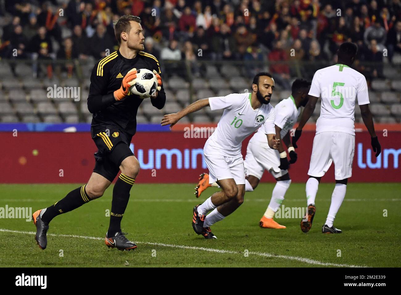 Belgium's goalkeeper Simon Mignolet and Saudi Arabia's forward Mohammad Al-Sahlawi pictured at a friendly game between the Red Devils Belgian National soccer team and Saudi Arabia, in Brussels, Tuesday 27 March 2018. BELGA PHOTO DIRK WAEM Stock Photo