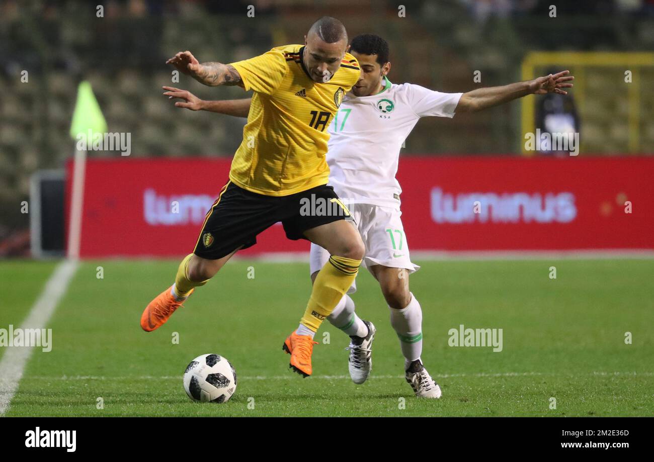 Belgium's Radja Nainggolan and Saudi Arabia's captain Taisir Al-Jassim fight for the ball during a friendly game between the Red Devils Belgian National soccer team and Saudi Arabia, in Brussels, Tuesday 27 March 2018. BELGA PHOTO VIRGINIE LEFOUR Stock Photo
