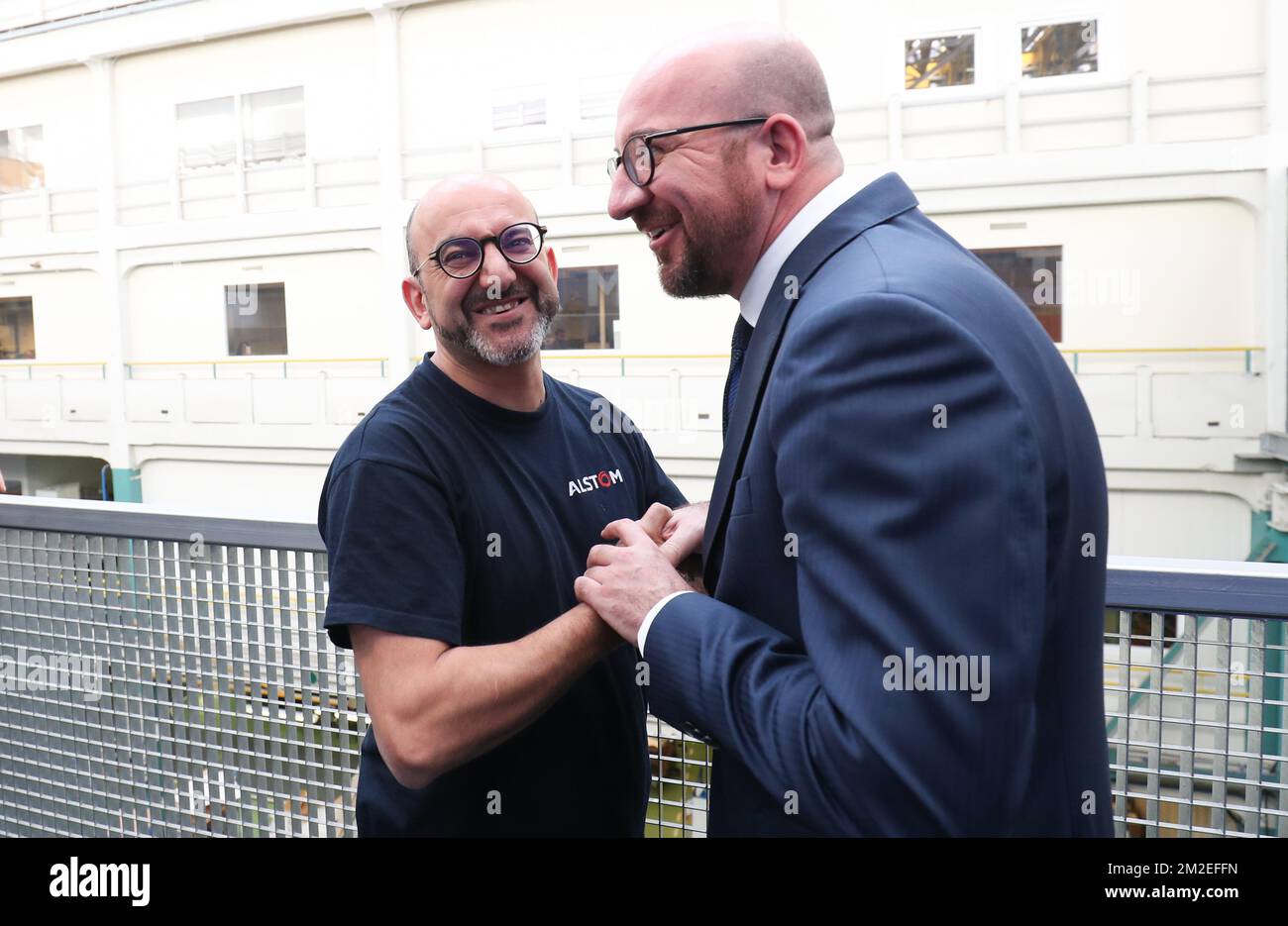 Belgian Prime Minister Charles Michel and a doppleganger pictured during a visit to the Alstom transport materials producer in Charleroi, Tuesday 17 April 2018. BELGA PHOTO VIRGINIE LEFOUR Stock Photo