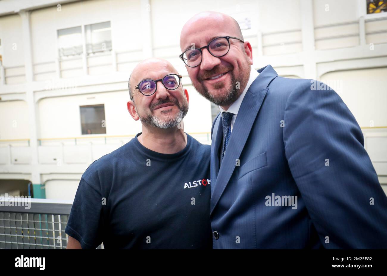 Belgian Prime Minister Charles Michel and a doppleganger pictured during a visit to the Alstom transport materials producer in Charleroi, Tuesday 17 April 2018. BELGA PHOTO VIRGINIE LEFOUR Stock Photo