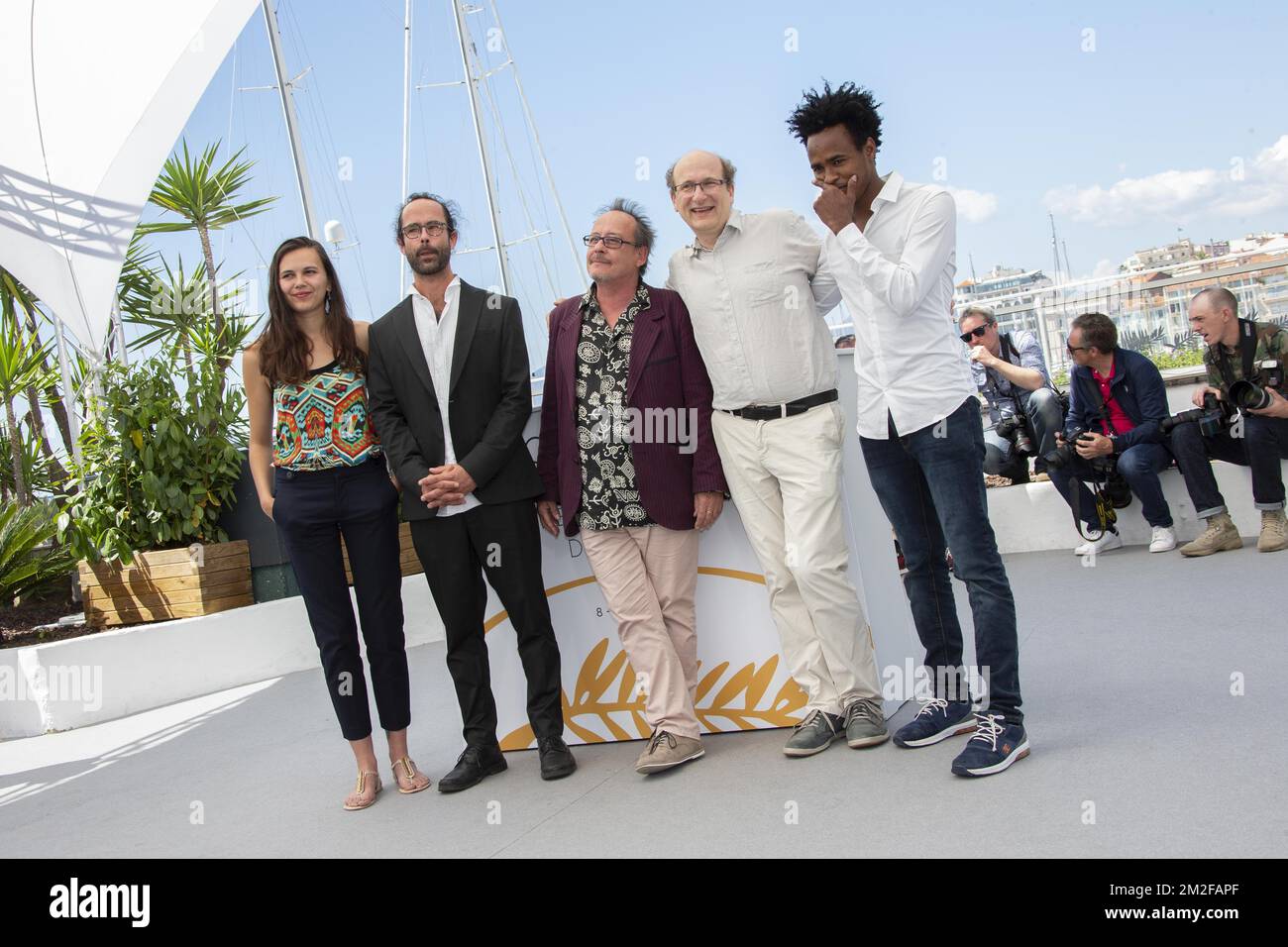 Michel TOESCA, Cedric Herrou and guests attends the 'Libre' Photocall during the 71st annual Cannes Film Festival at Palais des Festivals | Michel TOESCA, Cedric Herrou et des invités assistent au Photocall de 'Libre' lors du 71ème Festival de Cannes au Palais des Festivals. 18/05/2018 Stock Photo