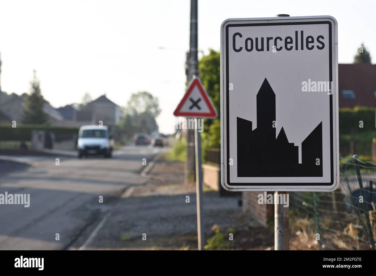 Illustration shows the name of the Courcelles municipality on a road sign, Tuesday 08 May 2018