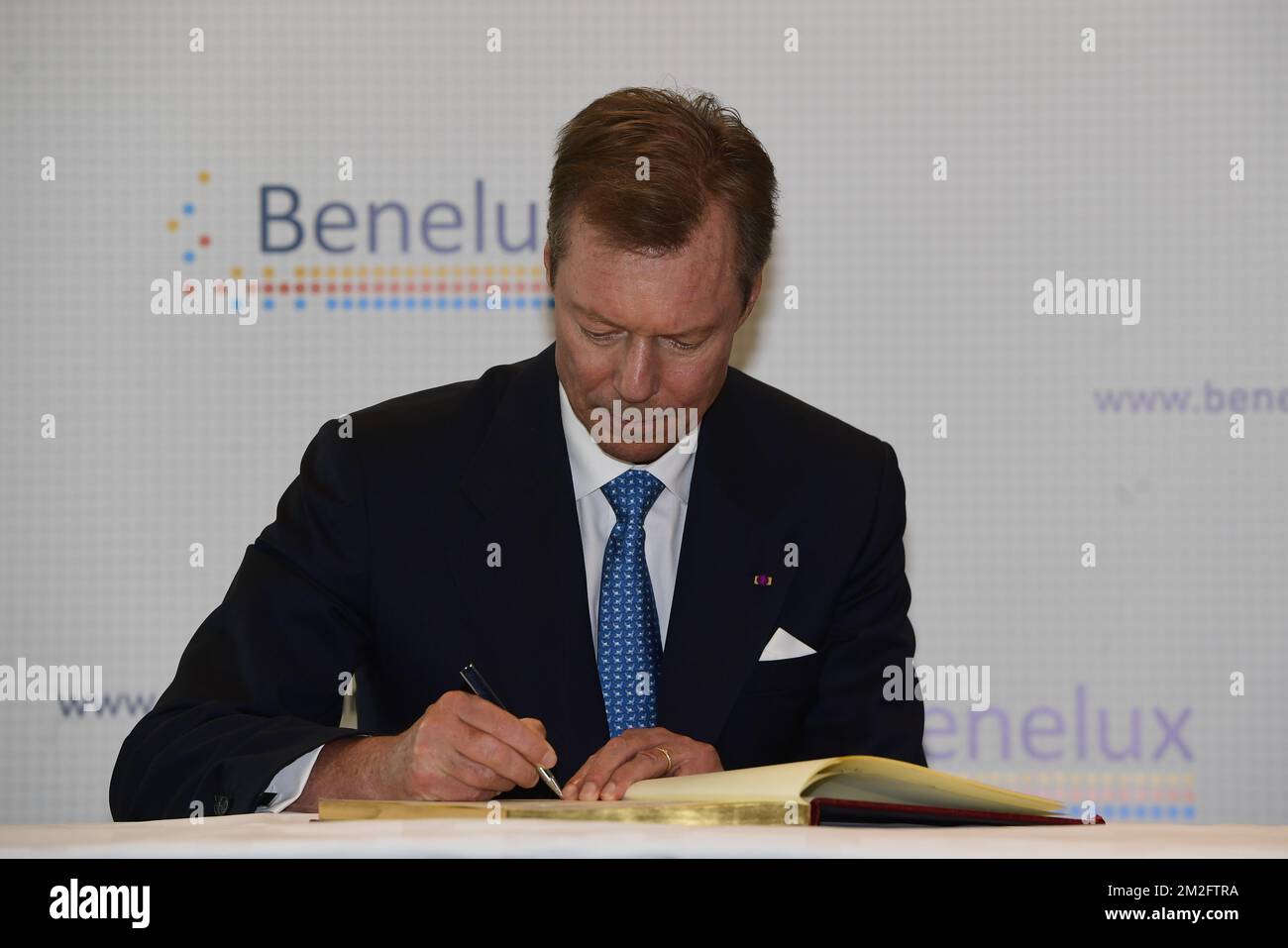 Grand Duke Henri of Luxembourg signs the golden book at a visit to the Benelux General Secretariat on the occasion of the 60th anniversary of the Benelux Union, Tuesday 05 June 2018, at the Royal Palace in Brussels. BELGA PHOTO LAURIE DIEFFEMBACQ  Stock Photo