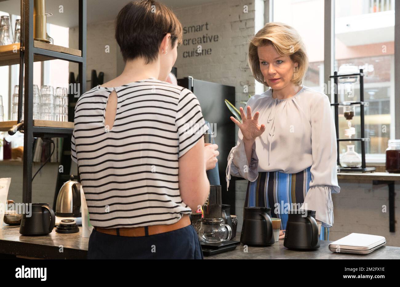 Queen Mathilde of Belgium tastes a cup of coffee during a royal visit to the 'microStart' microcredit financing project in Gent, Thursday 07 June 2018. BELGA PHOTO BENOIT DOPPAGNE Stock Photo