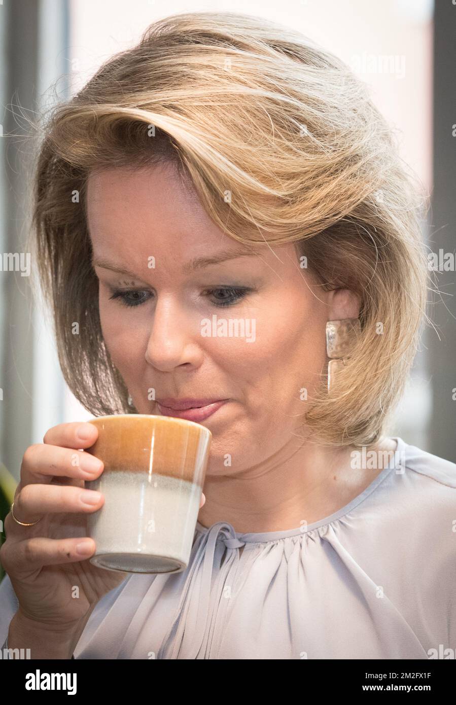 Queen Mathilde of Belgium tastes a cup of coffee during a royal visit to the 'microStart' microcredit financing project in Gent, Thursday 07 June 2018. BELGA PHOTO BENOIT DOPPAGNE Stock Photo