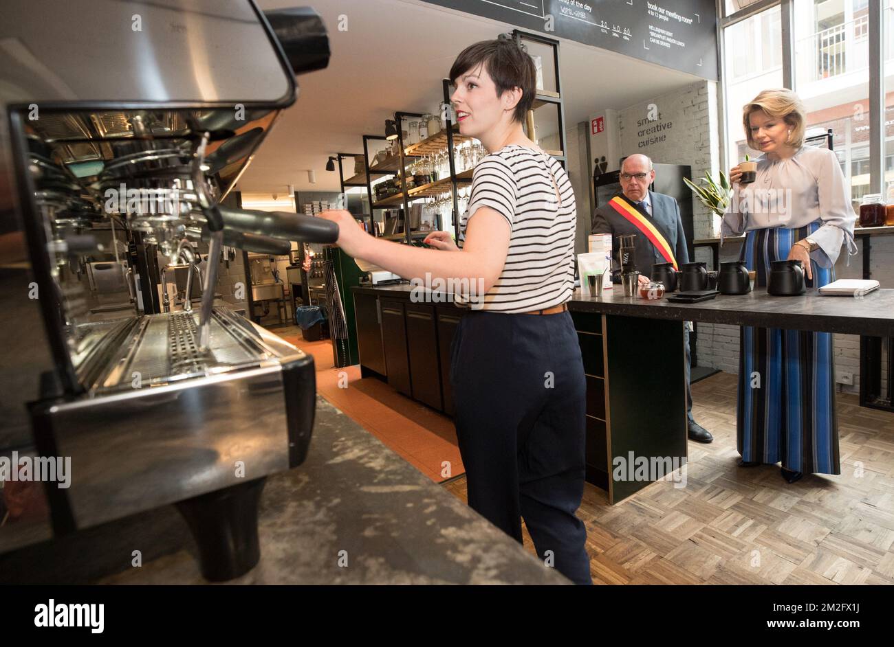 Queen Mathilde of Belgium and Gent mayor Daniel Termont taste a cup of coffee during a royal visit to the 'microStart' microcredit financing project in Gent, Thursday 07 June 2018. BELGA PHOTO BENOIT DOPPAGNE Stock Photo