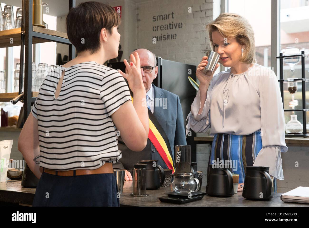Queen Mathilde of Belgium and Gent mayor Daniel Termont taste a cup of coffee during a royal visit to the 'microStart' microcredit financing project in Gent, Thursday 07 June 2018. BELGA PHOTO BENOIT DOPPAGNE Stock Photo