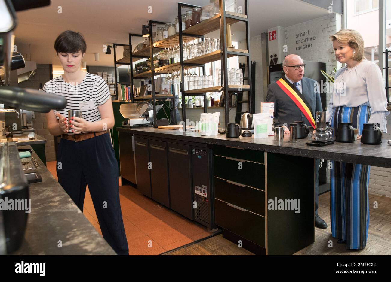 Queen Mathilde of Belgium and Gent mayor Daniel Termont taste a cup of coffee during a royal visit to the 'microStart' microcredit financing project in Gent, Thursday 07 June 2018. BELGA PHOTO BENOIT DOPPAGNE Stock Photo