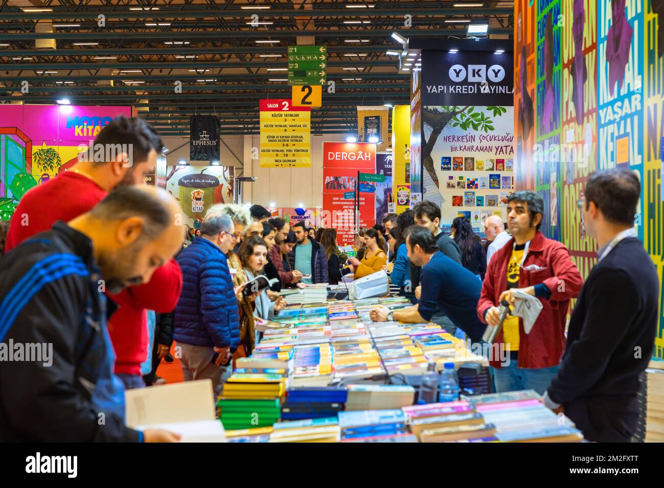 People buying books in the book fair. TUYAP Istanbul book fair. Istanbul Turkiye - 12.3.2022 Stock Photo