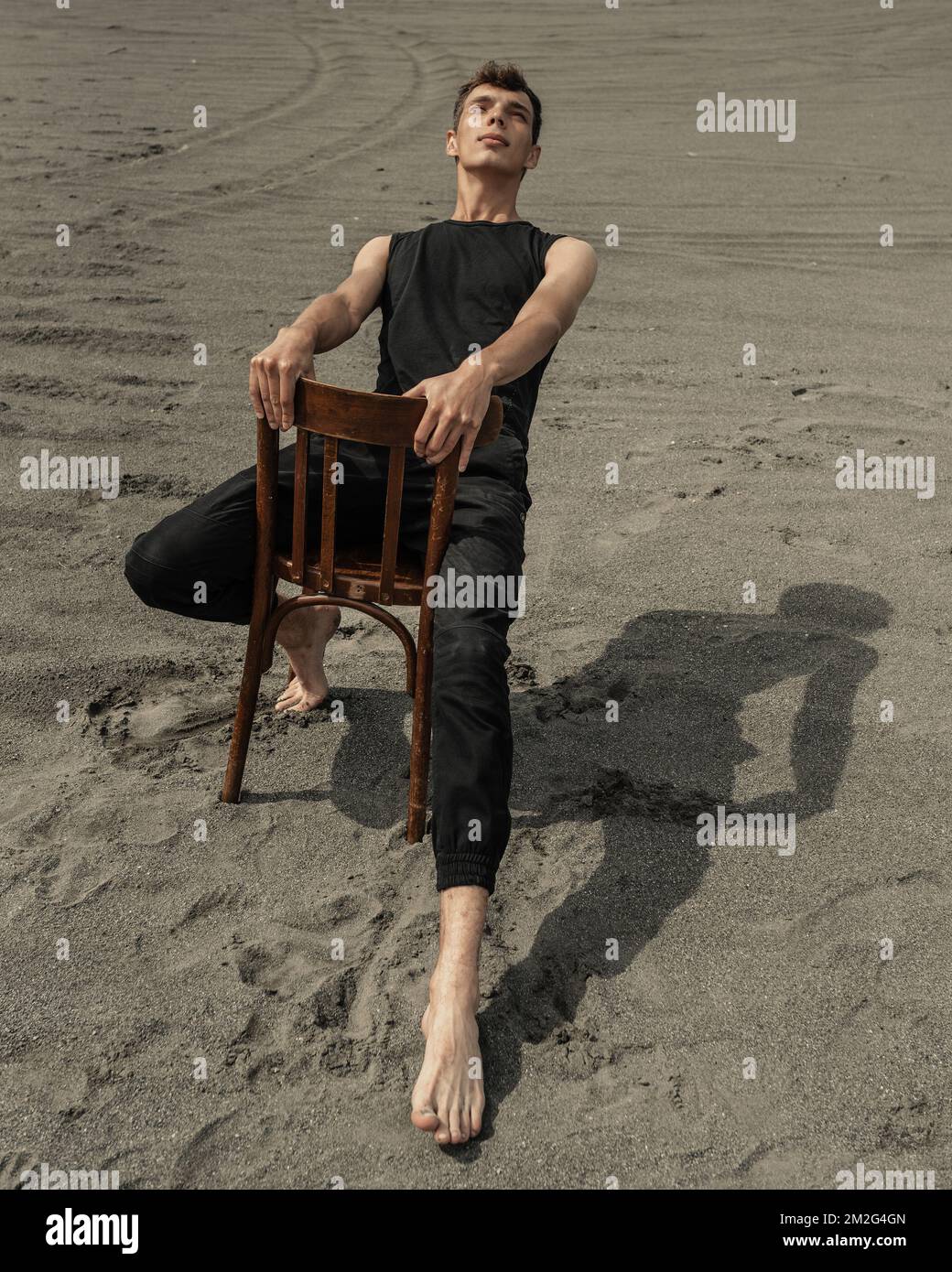 Sitting in chair barefoot hi-res stock photography and images - Alamy