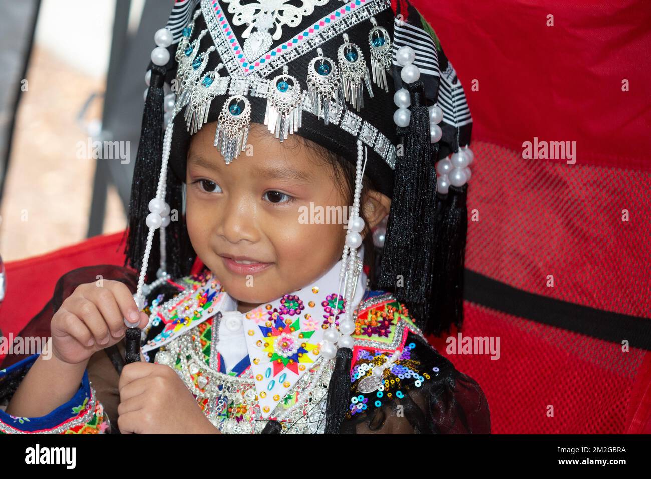 Girl dressed in traditional costume at Hmong New Year Celebration at El