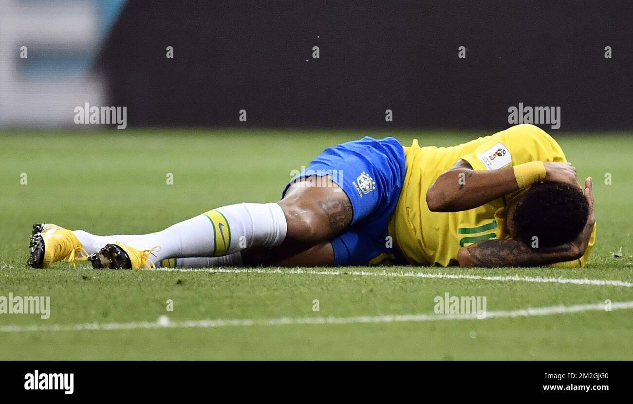 Brazil's Neymar lies on the ground during a soccer game between Belgian national soccer team the Red Devils and Brazil in Kazan, Russia, Friday 06 July 2018, the quarter-finals of the 2018 FIFA World Cup. BELGA PHOTO DIRK WAEM  Stock Photo