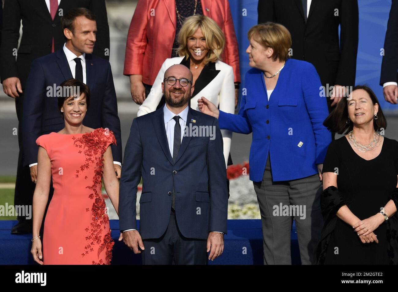 (front L-R) Amelie Derbaudrenghien, Belgian Prime Minister Charles Michel, Ingrid Schulerud, wife of NATO general secretary, (top L-R) President of France Emmanuel Macron, Brigitte Macron and Chancellor of Germany Angela Merkel pose for a family picture, ahead of a dinner at the Parc du Cinquantenaire - Jubelpark park in Brussels, for the participants of a NATO (North Atlantic Treaty Organization) summit, Wednesday 11 July 2018. BELGA PHOTO ERIC LALMAND  Stock Photo