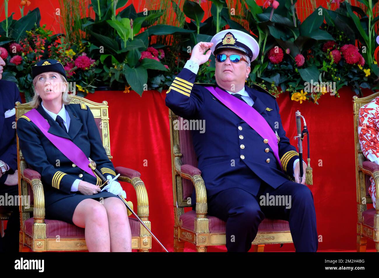 Belgian Prince Laurent (L) is pictured with Princess Claire (R) and her  daughter Princess Louise on the podium during the military parade on the  occasion of Belgium?s National Day in Brussels, Belgium