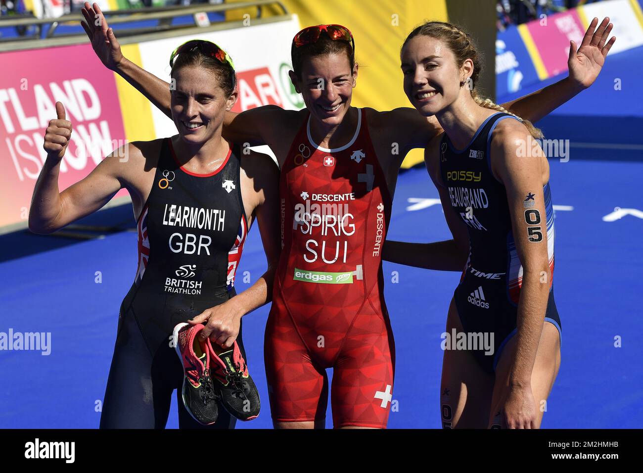 L-R, silver medalist Great Britain Jess Learmonth, Winner Swiss Nicola Spirig and Bronze medalist French Cassandre Beaugrand celebrate after the finish line of the women's triathlon event at the European Championships, in Glasgow, Scotland, Thursday 09 August 2018. European championships of several sports will be held in Glasgow from 03 to 12 August. BELGA PHOTO ERIC LALMAND Stock Photo
