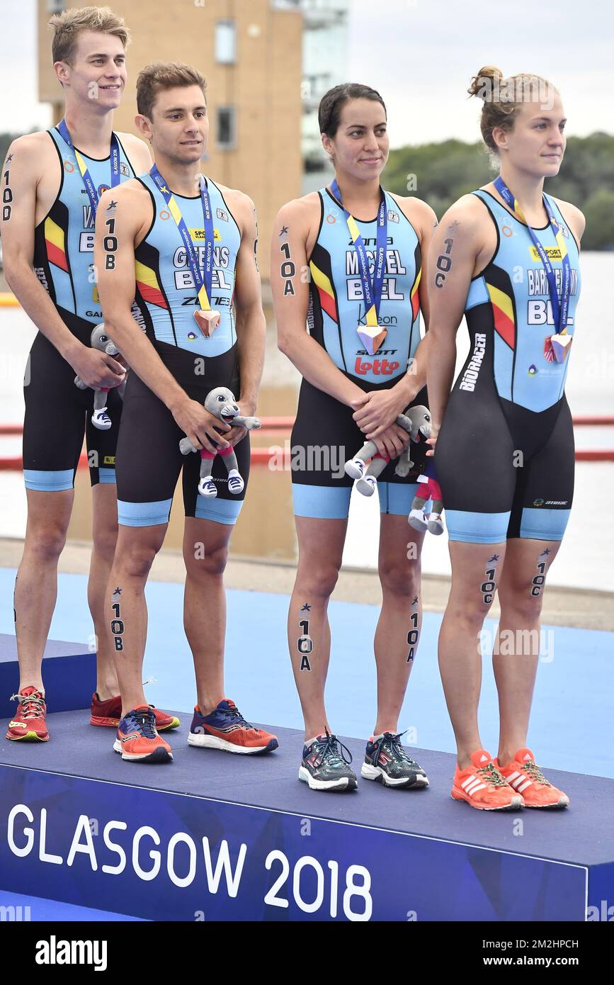 Belgian triathlete Claire Michel, Belgian triathlete Valerie Barthelemy, Belgian triathlete Jelle Geens and Belgian triathlete Marten Van Riel celebrate their bronze medal at the Mixed Team Relay triathlon event at the European Championships, in Glasgow, Scotland, Saturday 11 August 2018. European championships of several sports will be held in Glasgow from 03 to 12 August. BELGA PHOTO ERIC LALMAND  Stock Photo