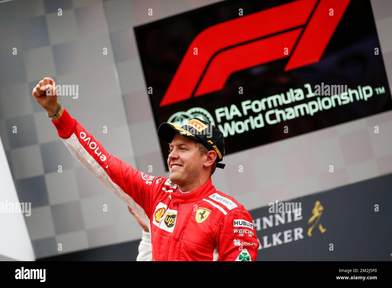 Vettel 2018 Ferrari's German driver Sebastian Vettel celebrates on the podium after ...